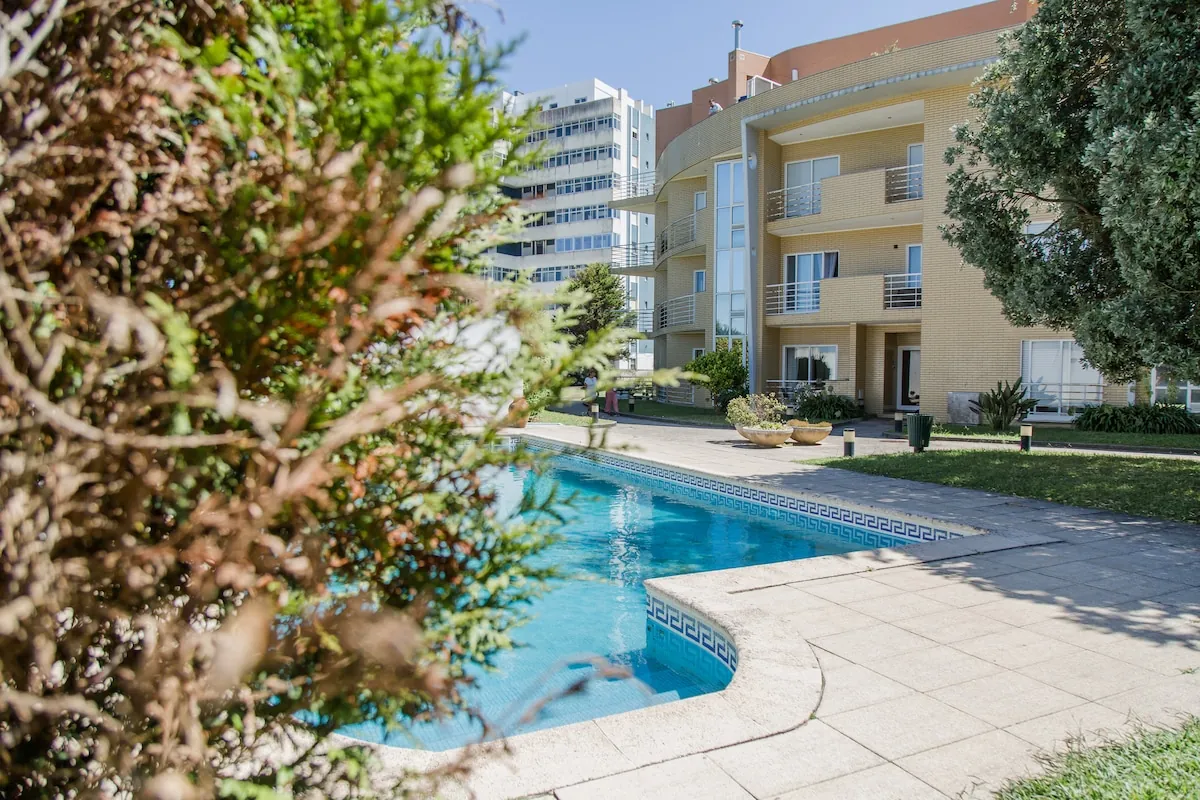 Shared swimming pool and garden at NorteSoul Miramar