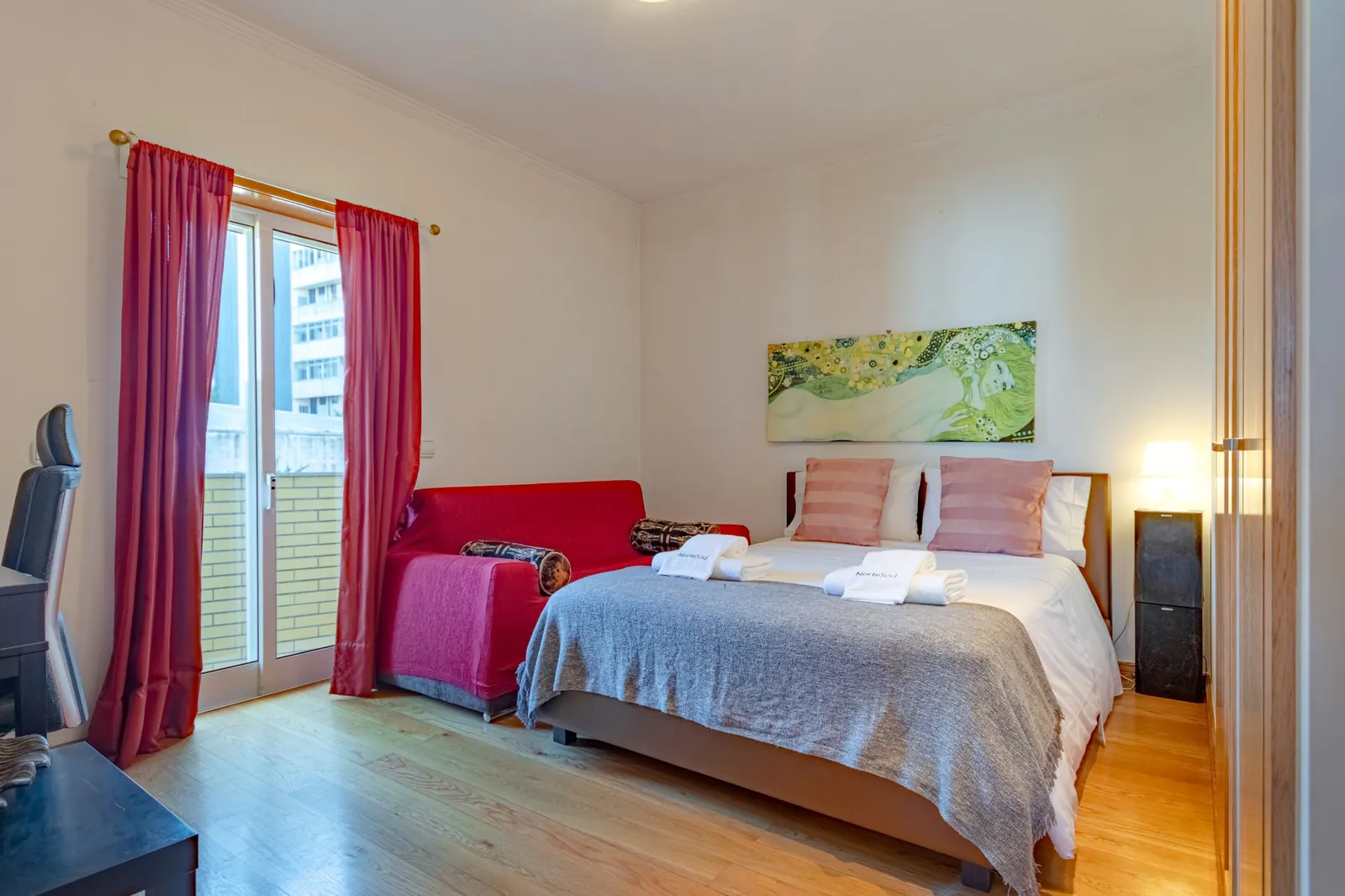 Bedroom with red velvet sofa bed